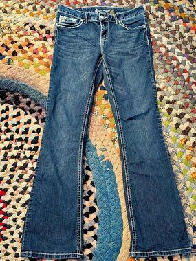 Soundgirl blue bootcut jeans with white stitching and fleur de lis design #denim